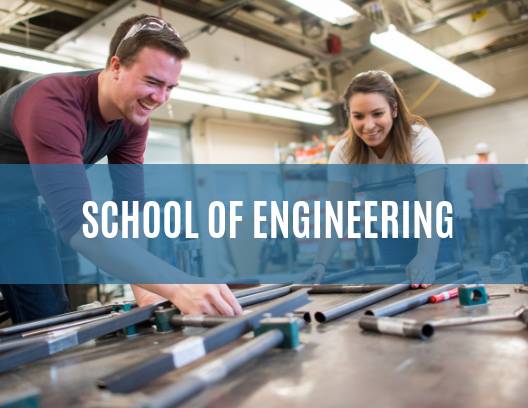 Link to School Of Engineering - Image of two students working on Engineering homework